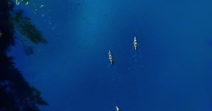 4K - Canoe On The River. View From Above