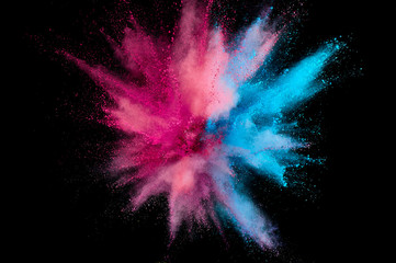Colored powder explosion. Abstract closeup dust on backdrop. Colorful explode. Paint holi