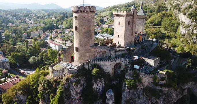 FOIX, FRANCE - October 06, 2018:  Picturesque autumn landscape with imposing medieval fortress Chateau de Foix on hill, France