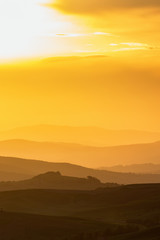 Fototapeta premium Sunset with shades in a rolling landscape