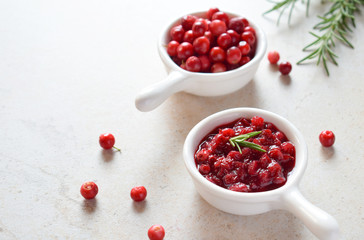 Cowberry sauce with rosemary and coconut sugar. Cranberry confiture. Spicy berry jam to meat, turkey. Autoimmune Paleo. Diet healthy food concept. Cereals Gluten Dairy free. Copy space.
