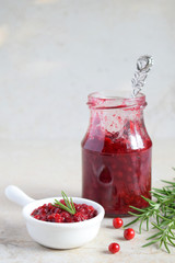 Cowberry sauce with rosemary and coconut sugar. Cranberry confiture. Spicy berry jam to meat, turkey. Autoimmune Paleo. Diet healthy food concept. Cereals Gluten Dairy free. Copy space.
