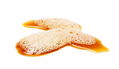 Spilled beer puddle with foam isolated on white background and texture, clipping path
