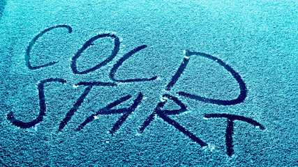 frozen glass of a car on a winter day, cold start