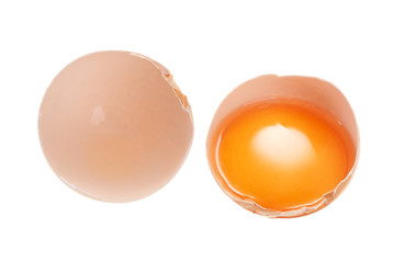 Broken chicken egg isolated on white background. View from above.