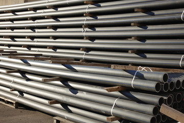 Plastic pipes in stock of finished products stacked in packs