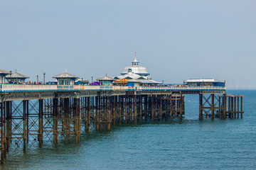 View of the pier and Victorian style architecture in Llandudno Bay, Wales.