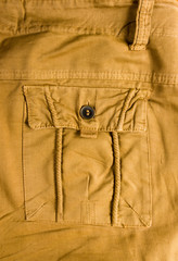 clothing items washed cotton fabric texture with seams, clasps, buttons and rivets