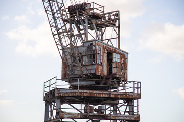 Fototapeta na wymiar old rusted crane tower