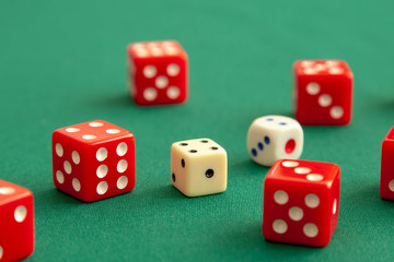 Red dices on green poker gaming table in casino. Concept online gambling