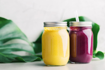 Fresh made smoothies in jars on table