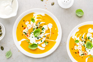 Pumpkin creamy soup served in bowl