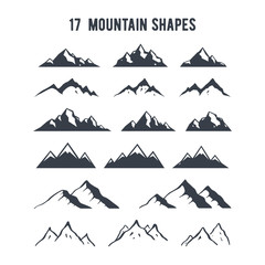 Set of hand drawn mountain silhouettes. Mountains peaks for creating logo, badges and emblems.