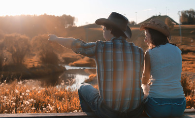 man and a girl are walking in the autumn