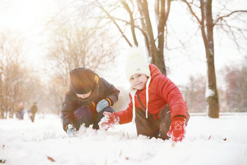 Children in winter park play