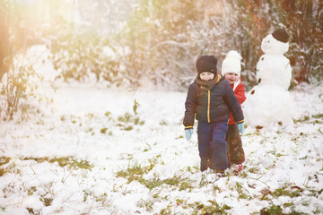Children in winter park play