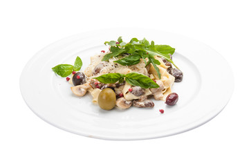 Tagliatelle with mushrooms and capers. On a white background