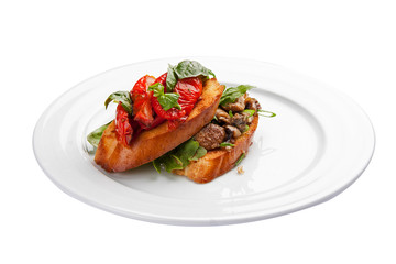Bruschetta with tomatoes and mushrooms. On a white background