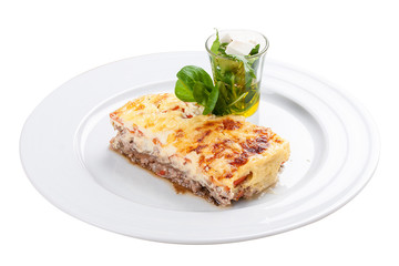 Moussaka. A traditional Greek dish. On a white background