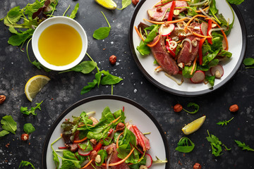 Spicy Beef Salad with Carrots, radish, bean sprouts, chilli, nuts and green mix