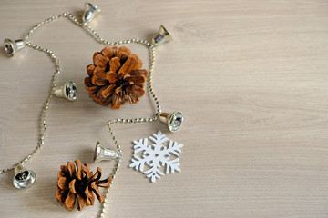 Christmas snowflake and silver bells on wooden background