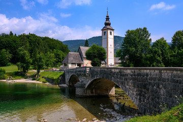 Church of St John the Baptist with bridge. Lake Bohinj. Triglav National Park, Julian Alps, Slovenia