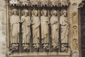 Fototapeta premium Ancient Parisian Architecture. Houses and churches. Sculptures The beauty of the city. City of love. Trips to places of interest.