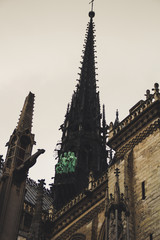 Fototapeta premium Ancient Parisian Architecture. Houses and churches. Sculptures The beauty of the city. City of love. Trips to places of interest.