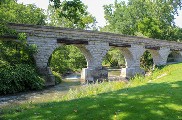 Fototapeta na wymiar 5 Arch Bridge in Avon, NY. Built by the Genesee Valley RR, the historic bridge spans the Conesus outlet