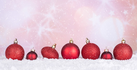 Red Christmas Baubles With Snow on a Bright Background