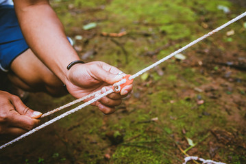 hand force catch the lock. force rope. tent rope buckle © last19