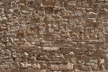 Rustic wall texture of irregular stones 