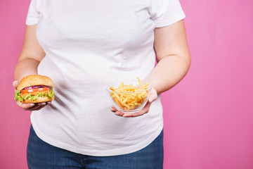 weight loss, overweight, plus size, diet, unhealthy eating, overeating. fat woman with fast food