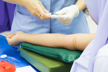 Medical selective syringe on arm patient to collect blood for test the health