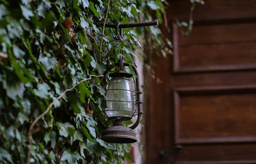 Old kerosene lamp at the entrance to the House