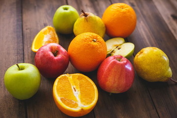 Fresh fruit on the table top made of natural wood. Healthy Eating