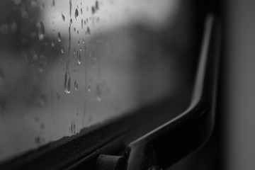 looking at the rain drops through a gloomy window