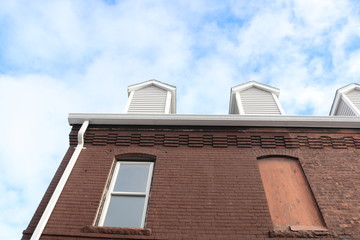 Boarded up vacant brick industrial building