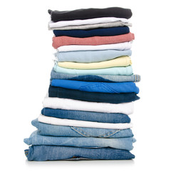 A stack of clothes jeans t-shirt shirt on a white background. Isolation