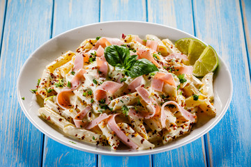 Pasta carbonara on wooden table