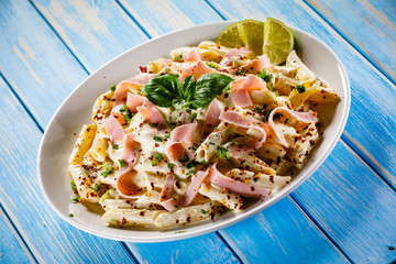 Pasta carbonara on wooden table