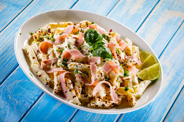 Pasta carbonara on wooden table