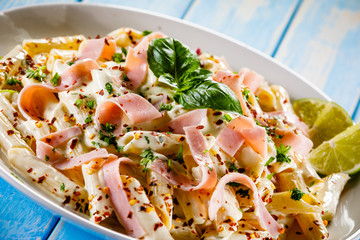 Pasta carbonara on wooden table