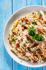 Pasta carbonara on wooden table