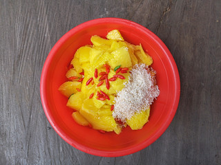Making a pickles of Mangifera pajang consist its seed and red chillies.It  is a species of plant in...