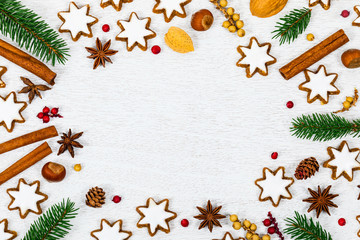 Christmas Background with Star Gingerbread Cookies and Holiday Decorations on White Wooden Background with Space for Text