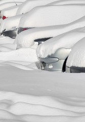 Beautiful pure white snow over the cars on the parking outdoor. Weather forecast, winter conditions for drivers. Winter concept.