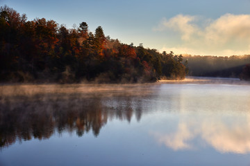 Fototapeta na wymiar Early morning autumn scene at Philpott Lake, located in the foothills of the Blue Ridge mountains near the town of Stuart, Virginia