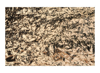 Rose gold crumpled foil texture isolated on white background