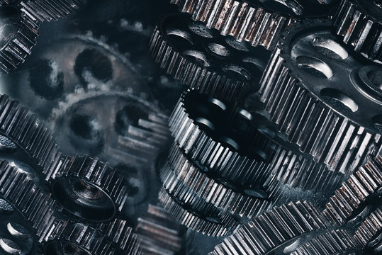 metallic gears/ Abstract mechanism from a variety of metal gray gears of different sizes close-up